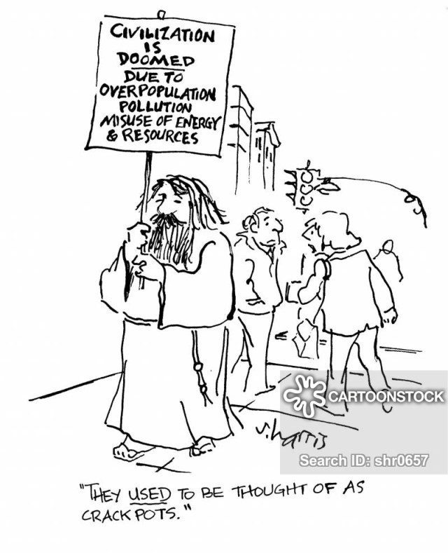 'They sed to be thought of as crackpots.' (Sign reads - civilization is doomed due to overpopulation, pollution, misuse of energy and resources.)